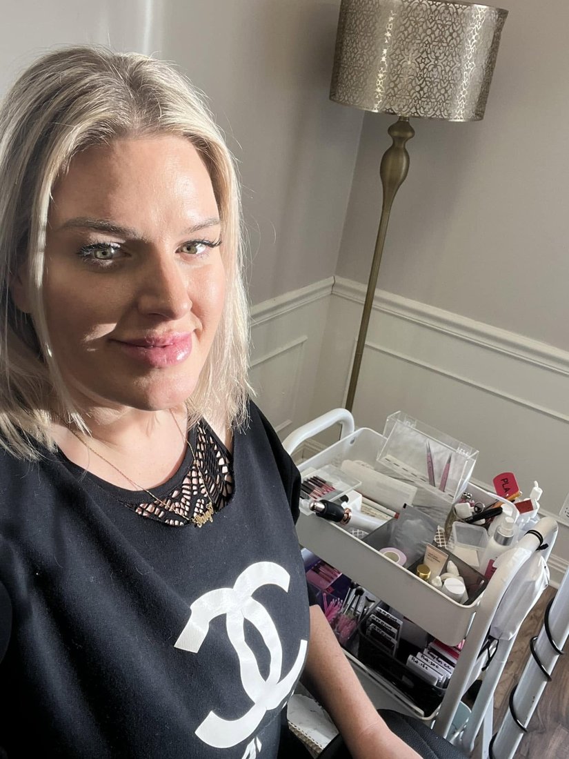 Paige Ojha in the studio beside her lash cart
